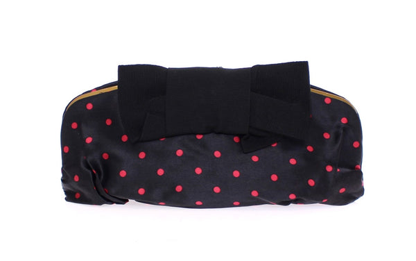 Black polka dotted silk clutch